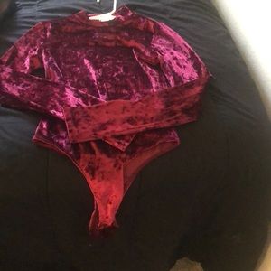 Never worn Fashion Nova red velvet body suit.